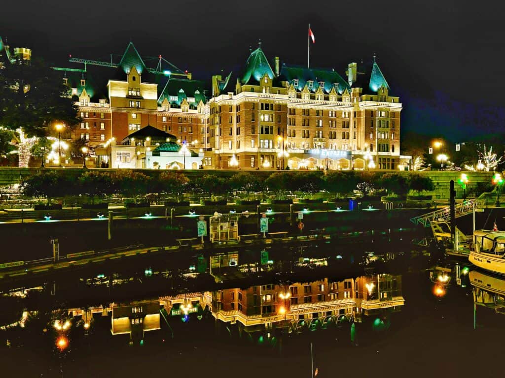  Fairmont Empress hotel lit up at night in Victoria, BC.