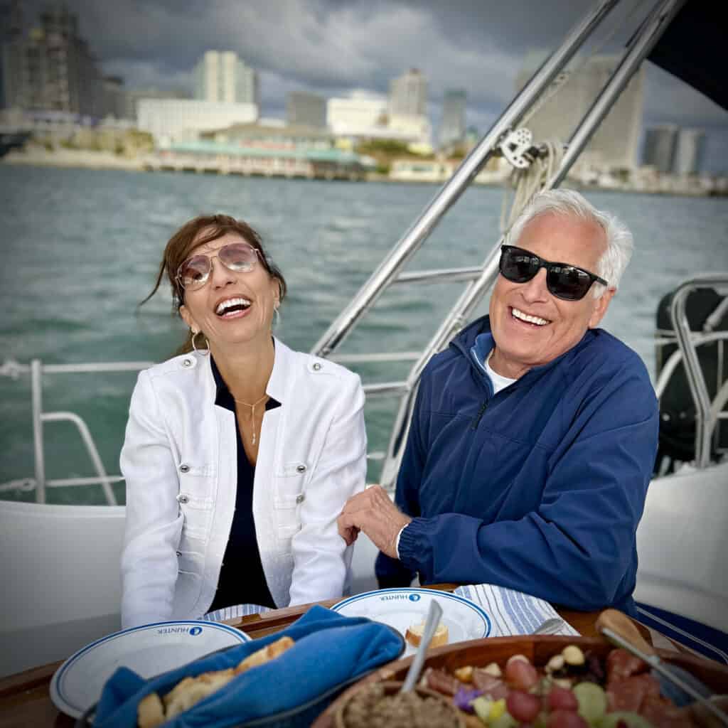 Couple dining on the deck of the Riviera sailboat