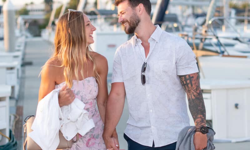 Couple on the dock after returning from a proposal sail on the San Diego Bay.