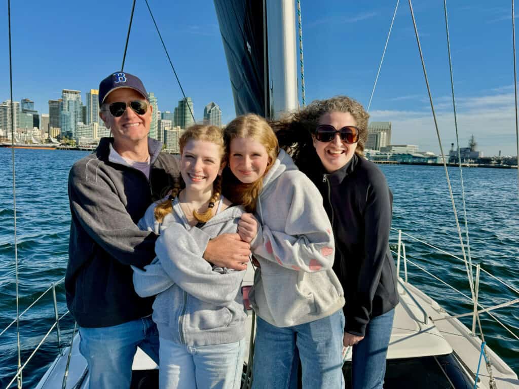 Parents and their two teenage daughters pose during a sailing trip on the SV Riviera. 