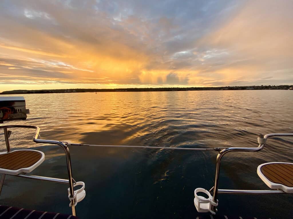 View of the sunset over the San Diego bay, as seen from the back of the Riviera sail boat.