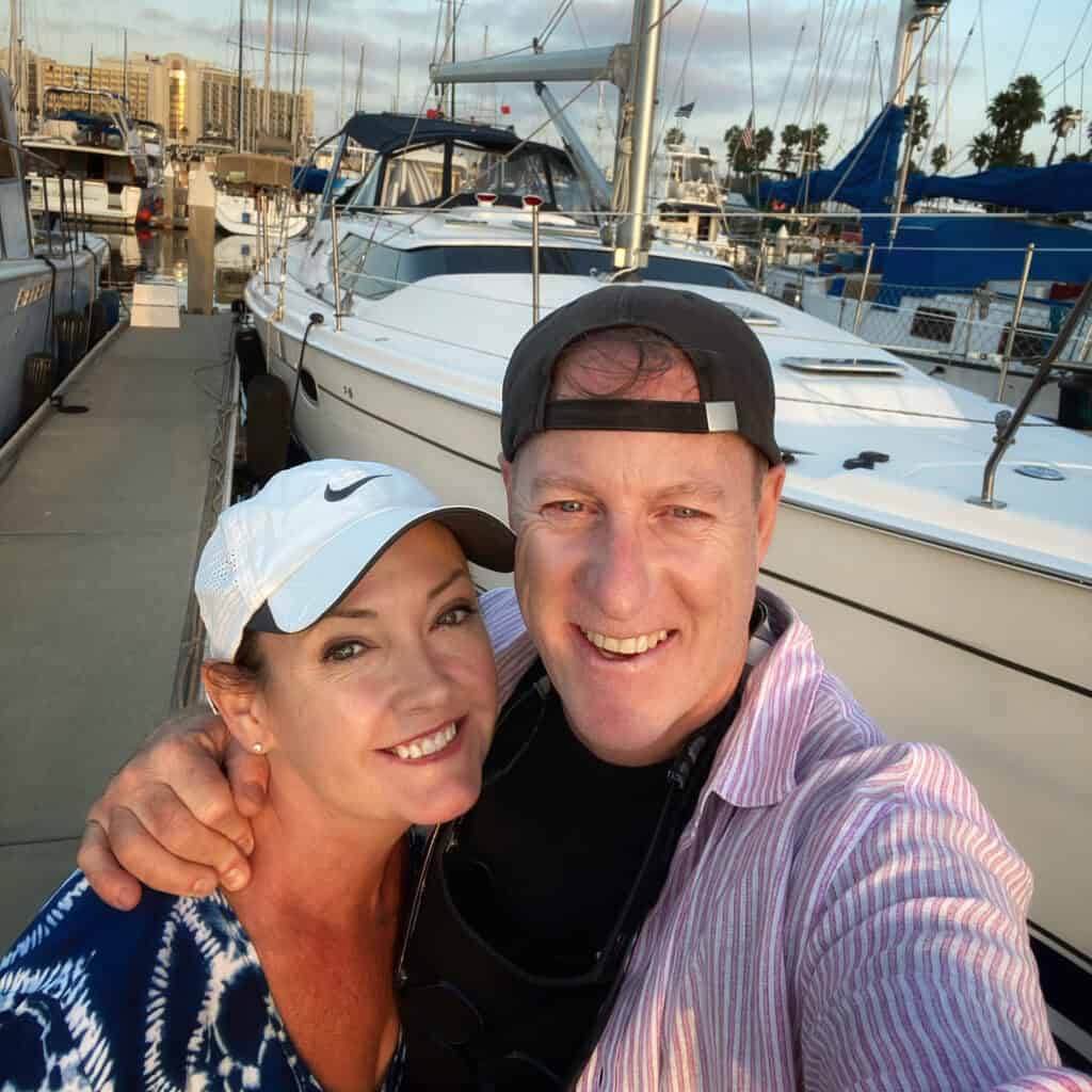 Paul & Victoria on the dock next to the Riviera sailboat