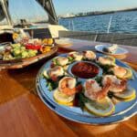Shrimp cocktails and fruit platter on the top deck of the SV Riviera sail boat.