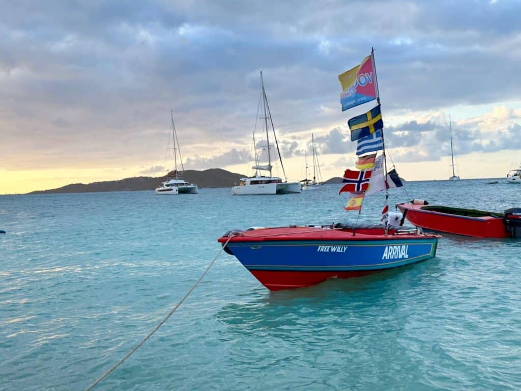 Small boats anchored in a harbor in the Caribbean.