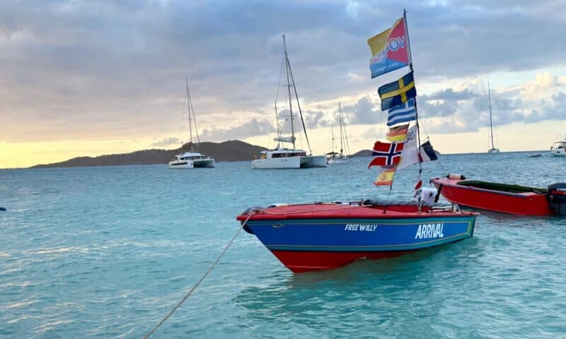Small boats anchored in a harbor in the Caribbean.