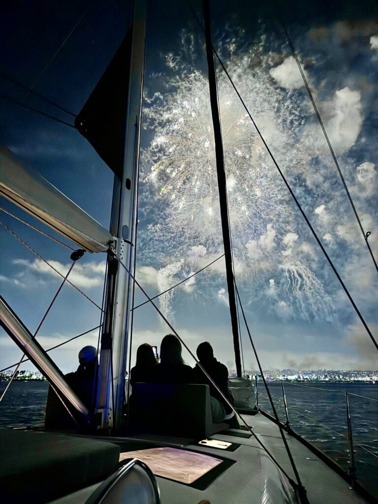 Guests aboard the S.V. Riviera watch fireworks from the deck on the 4th of July.