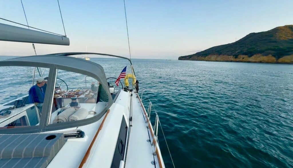 A sailboat yacht on open water, with no one around.