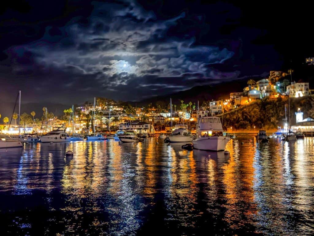 Catalina's town of Avalon at night, as seen from the harbor onboard the Riviera sailboat.