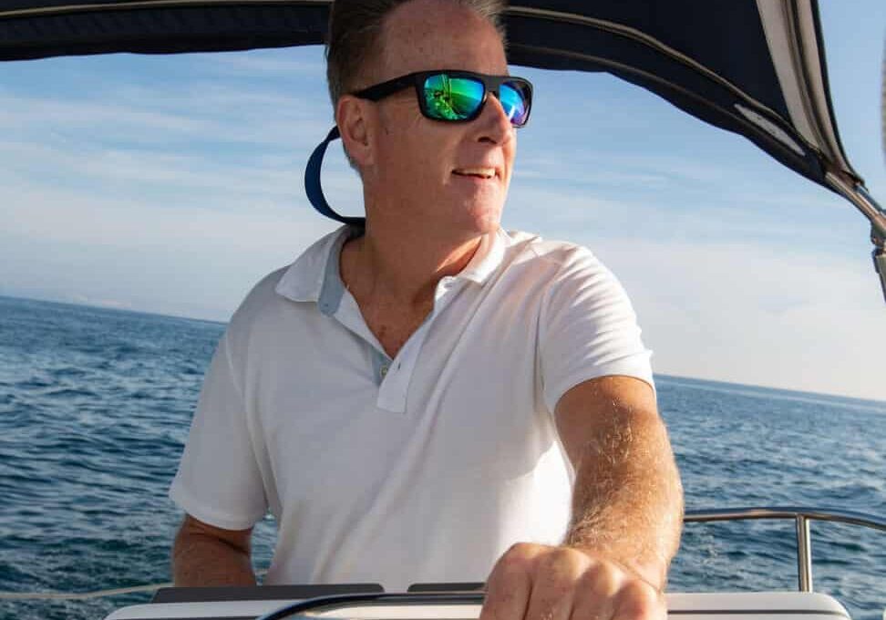 Captain Paul behind the wheel of his boat, Riviera