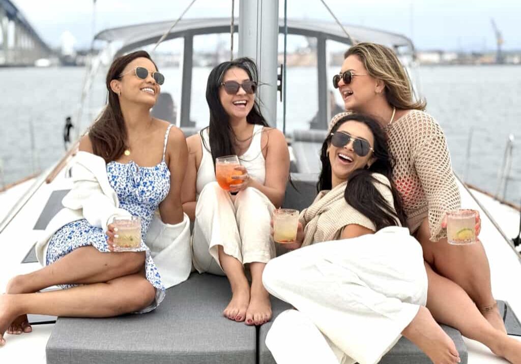 Women laughing on the deck of a yacht